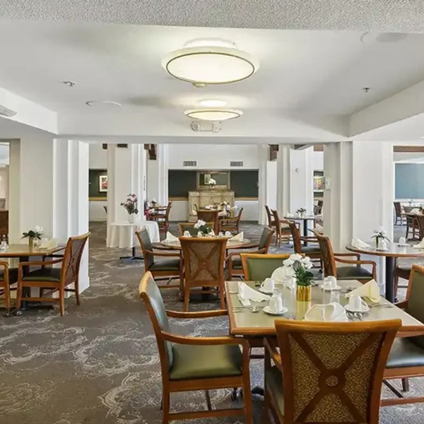 A room with tables and chairs.